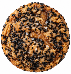 Brown butter and sugar cookie covered in black sesame seeds and topped with flakey salt.
