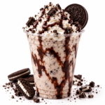 Cookies and cream milkshake topped with whipped cream, chocolate syrup, cookie crumbles and an Oreo cookie.